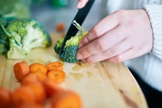photo of person chopping vegetables